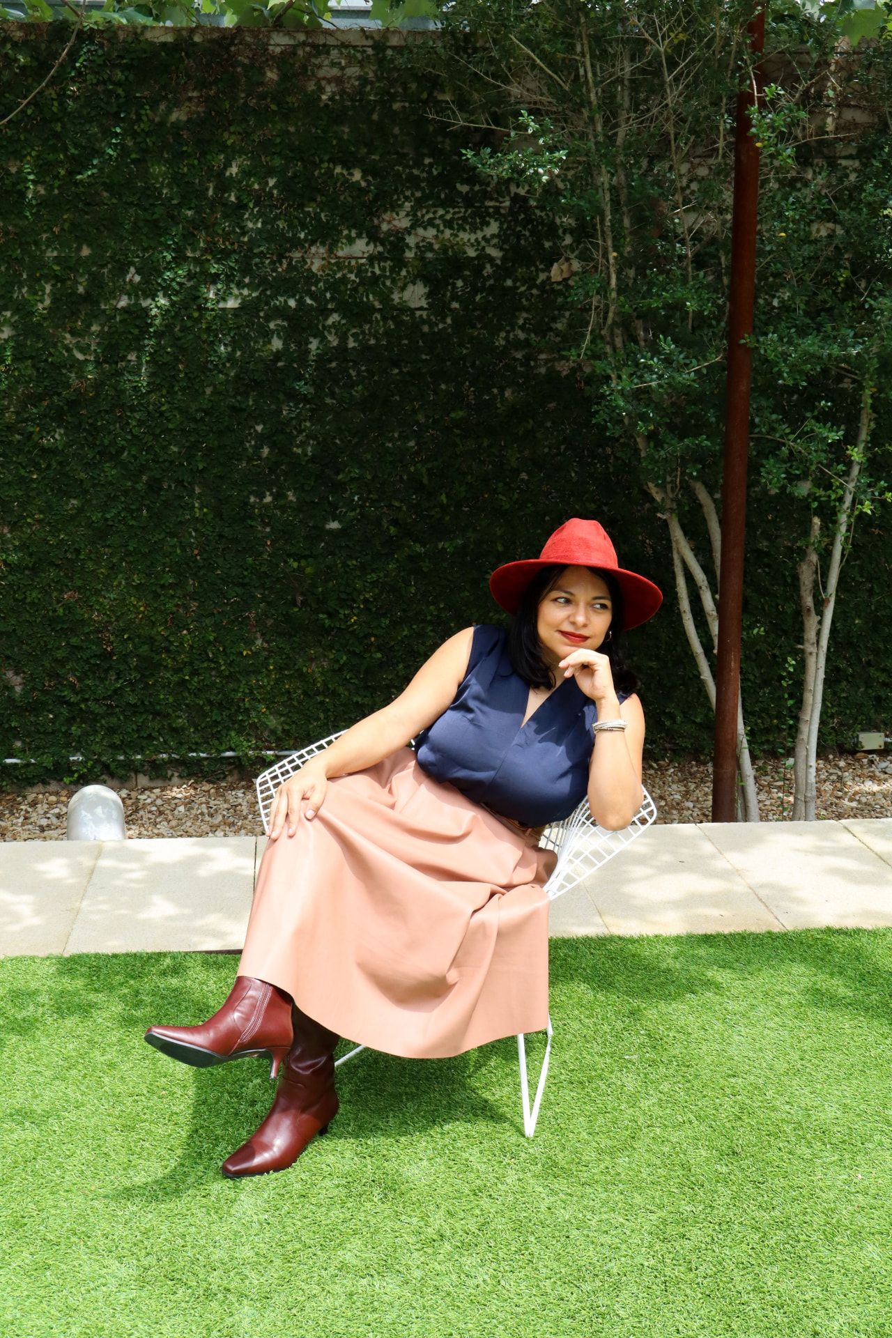 Nay Reyes seated outdoors in Austin, Texas